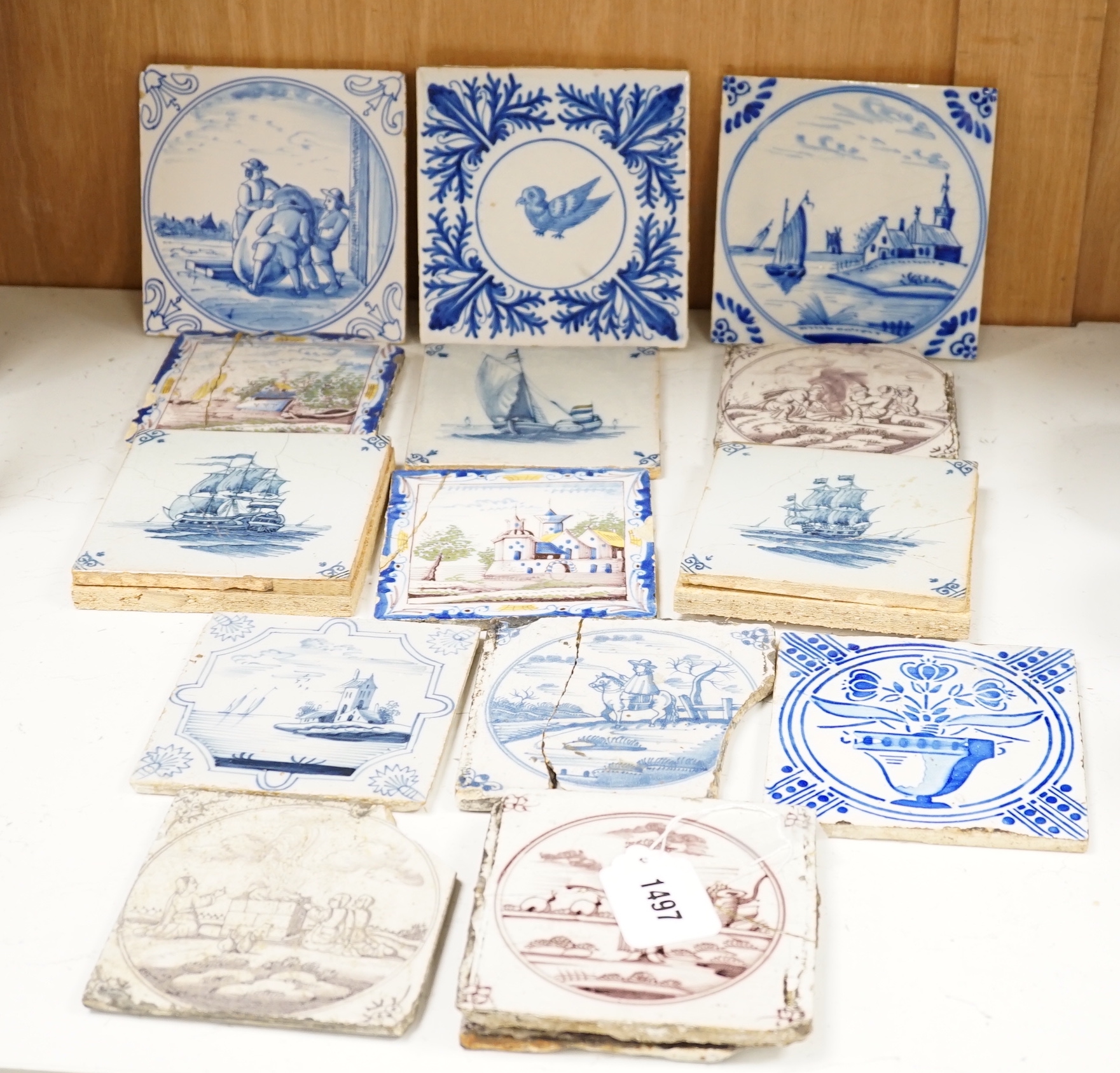 A group of Delft tiles including two polychrome examples and three decorated with ships, 18th/19th century, approximately 12.5cm x 12.5cm (a.f.)